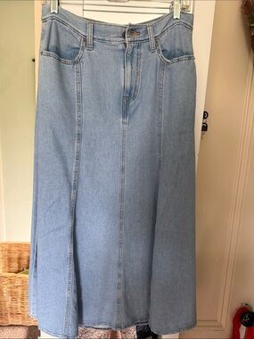Levi's Woman’s Light Blue Relaxed Denim Long Jean Skirt with Tan Leather patch.